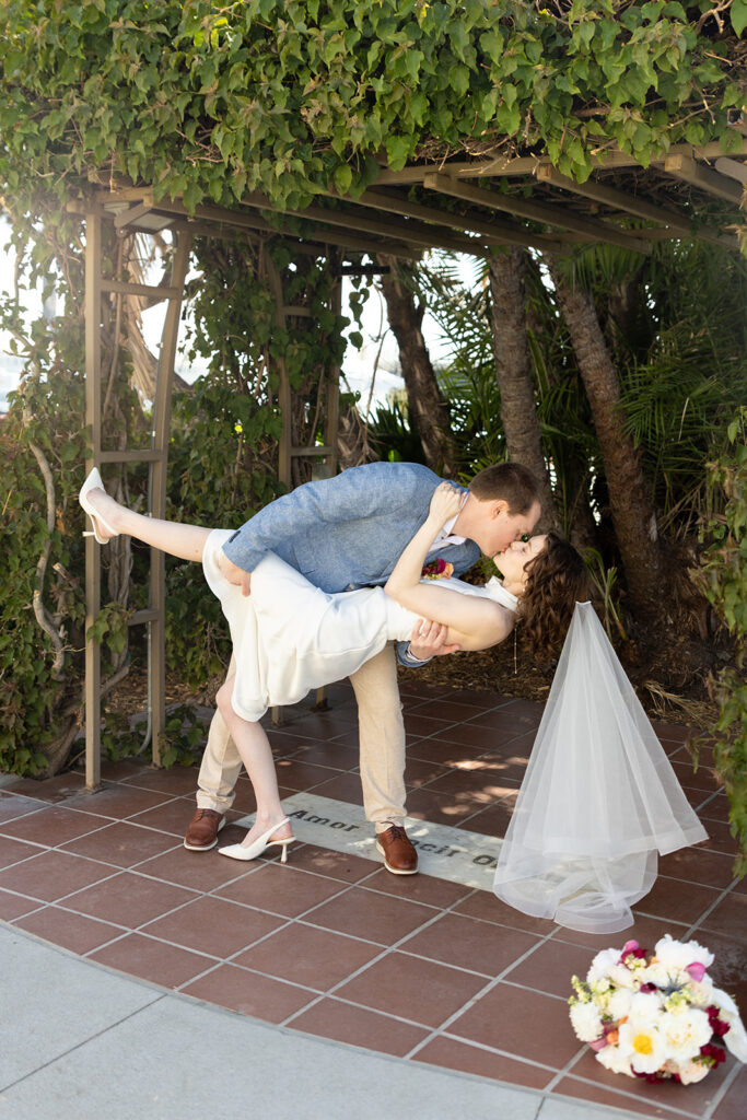 Couple kisses celebratory at marriage hut at San Diego courthouse wedding